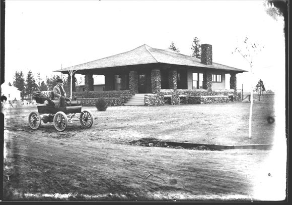 George W. Fox in front of Fox House, Photographs, Spokane City Historic Preservation Office, Washington State Archives, Digital Archives.