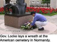 Gov. Locke lays a wreath at the American cemetery in Normandy.