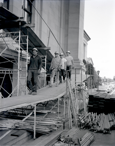 Construction workers repairing the legislative building after it was damaged in an earthquake on April 29, 1965. Legislative building, earthquake damage, exterior, 1965, Susan Parish Photograph Collection, 1889-1990, Washington State Archives, Digital Archives.