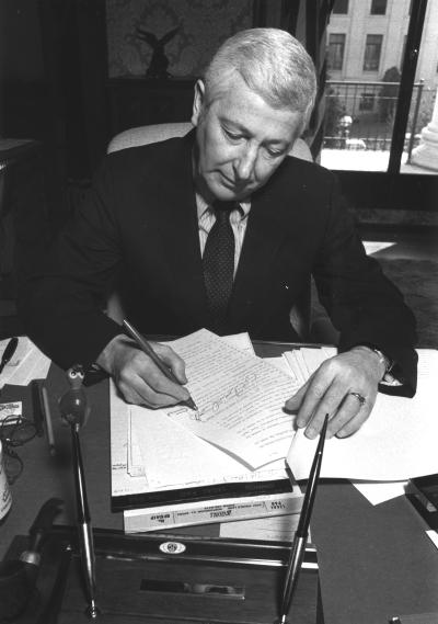 John D. Spellman at his desk